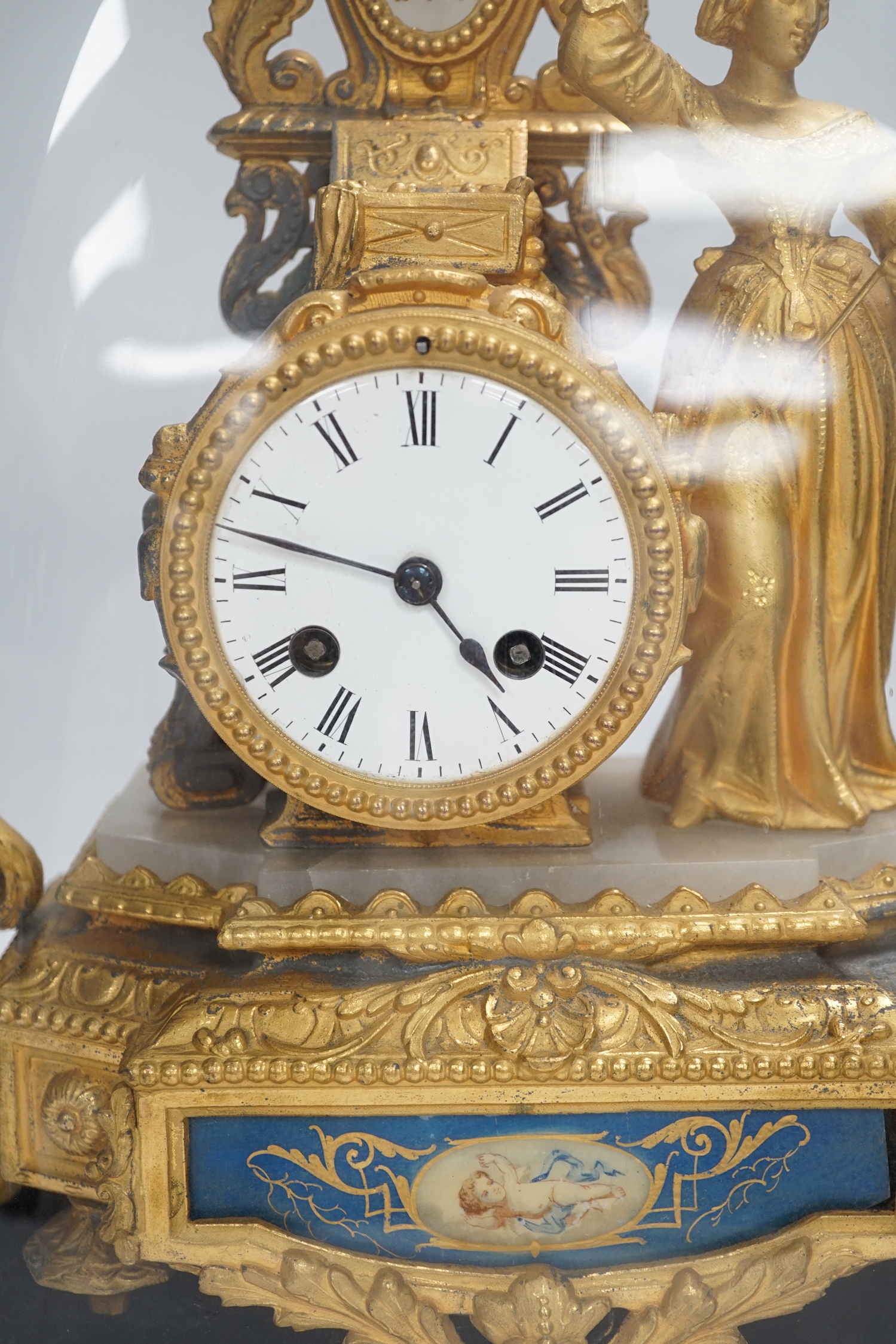 A French ormolu figural mantel clock with porcelain plaque under dome, 43cm high